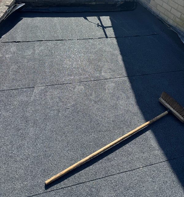 Storm Dry Roofing flat roof job, after: the same roof finished in new grey mineral felt